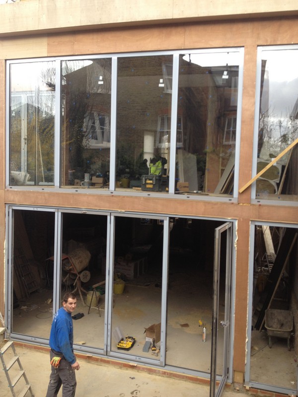 Aluminium bi-fold doors with two-storey glazing in Hounslow