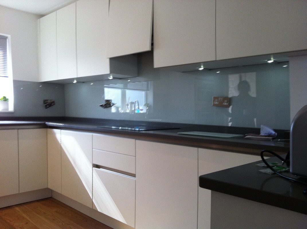 Grey glass kitchen splashback with LED lighting in Hounslow