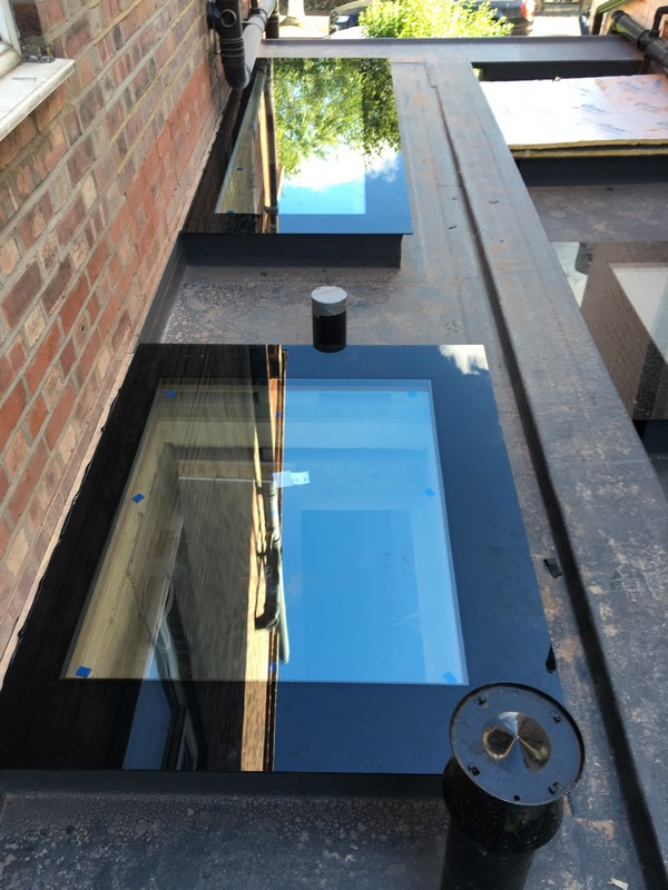 Multiple flat roof skylights on extension in Hounslow