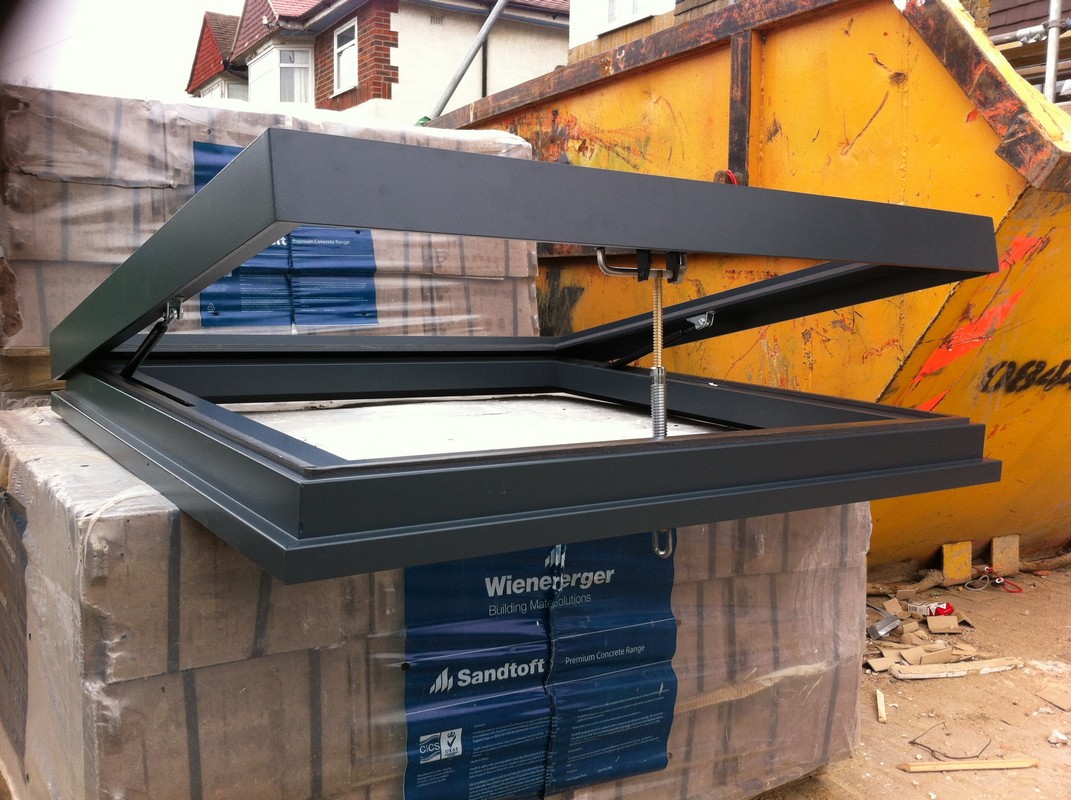 Opening flat roof skylight in anthracite grey installed in Hounslow