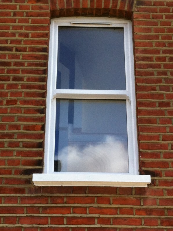 uPVC sash window on Victorian red brick house in Hounslow